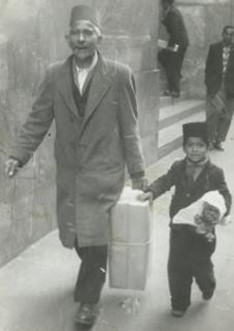 Imam Dout Sadien with his son Nazier, 1954